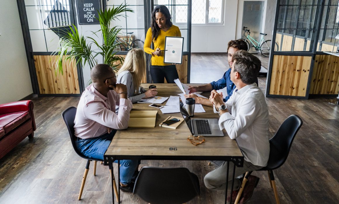 Businesswoman leading a presentation in loft office