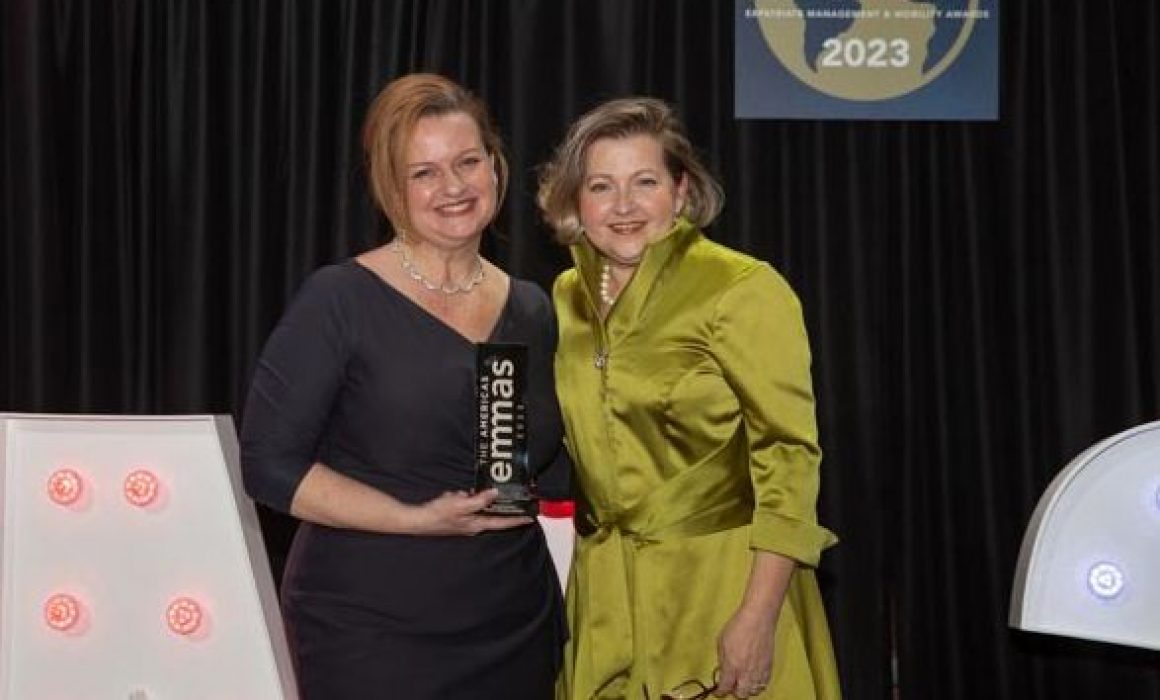 Two women holding emmas trophy at 2023 emmas
