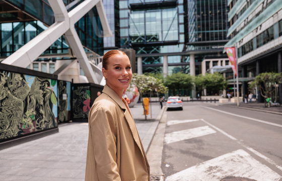 Professional walking through a modern Australian business district, representing Australia mobility trends and workforce strategy